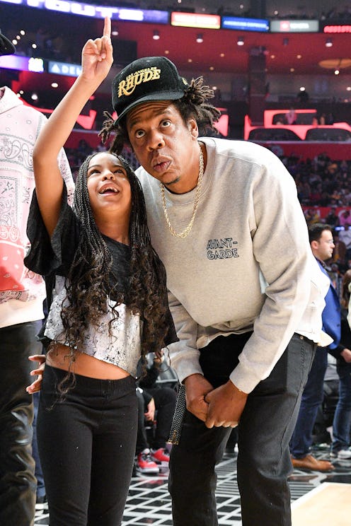 LOS ANGELES, CALIFORNIA - MARCH 08: Jay-Z and Blue Ivy Carter attend a basketball game between the L...