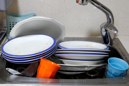Dirty washing up in sink