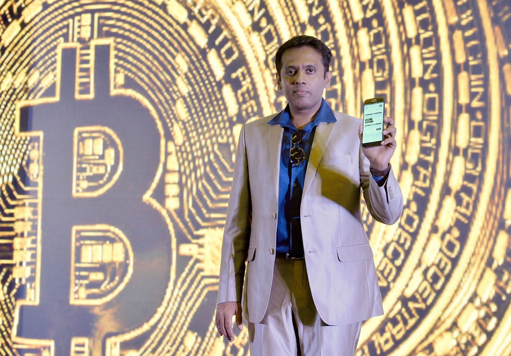 Indian Belfrics CEO of Praveen Kumar poses for a photograph at a press conference during the launch of the firms's Indian Bitcoin exchange operations in Bangalore on January 16, 2017. 