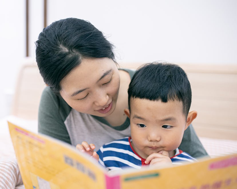 mom reading son a Bedtime story