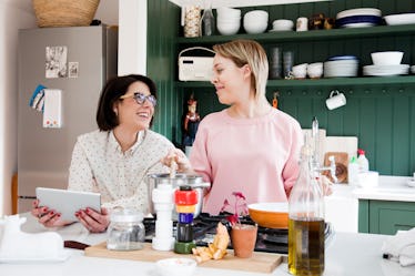 Two smiling women make TikTok Easter recipes using Peeps in their kitchen.