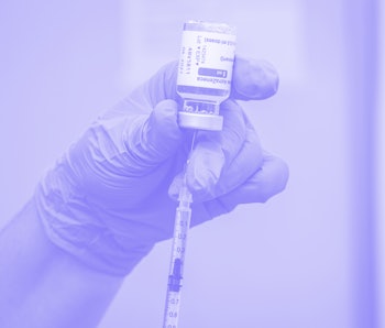 A syringe being filled