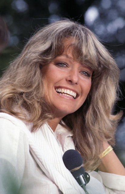 Farrah Fawcett with a signature hairstyle at an event.