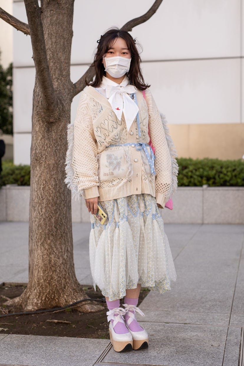 TOKYO, JAPAN - MARCH 15: A guest is seen on the street wearing Mikio Sakabe beige outfit with white ...