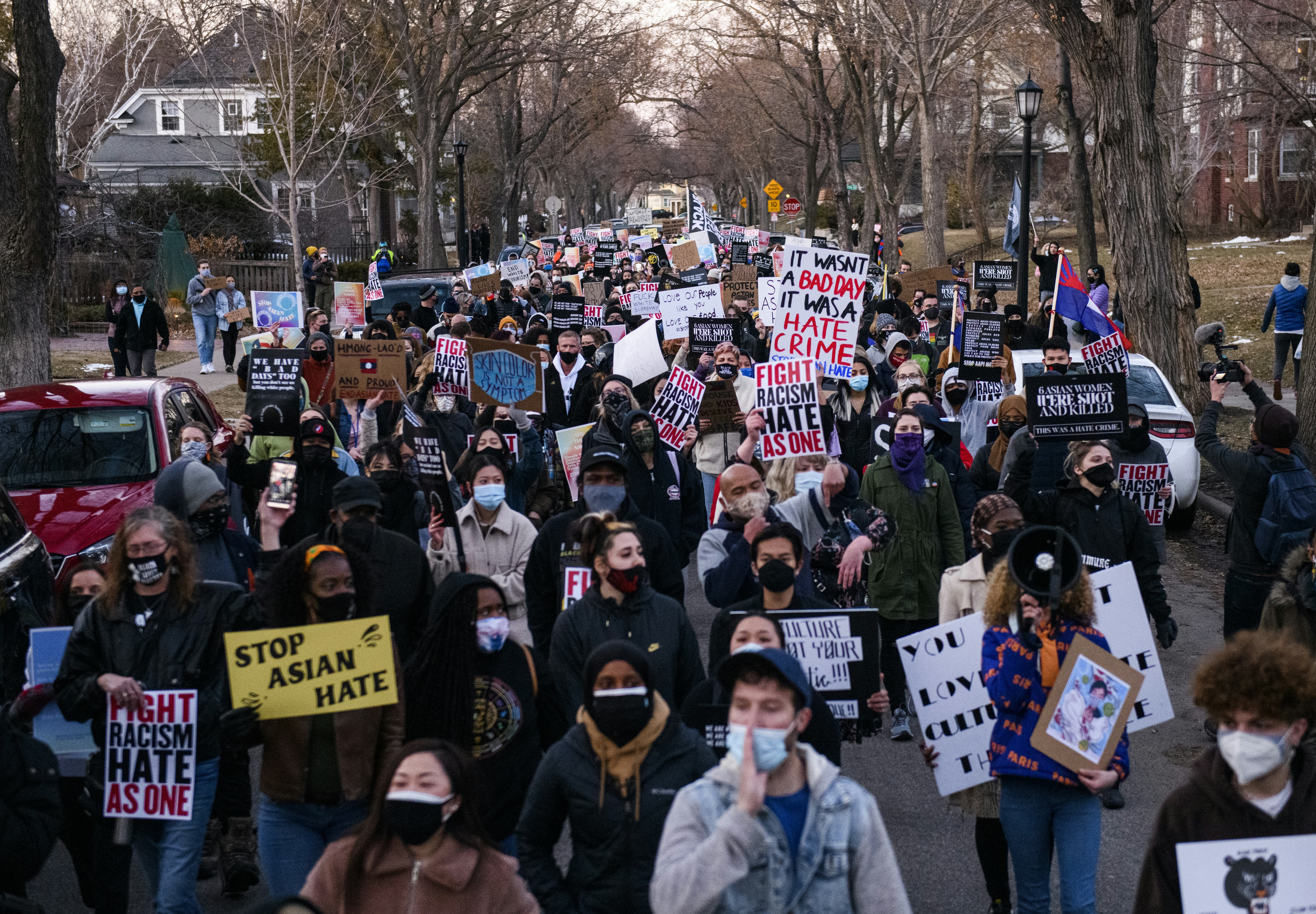 MINNEAPOLIS, MN - MARCH 18: People march through a neighborhood to protest against anti-Asian violen...