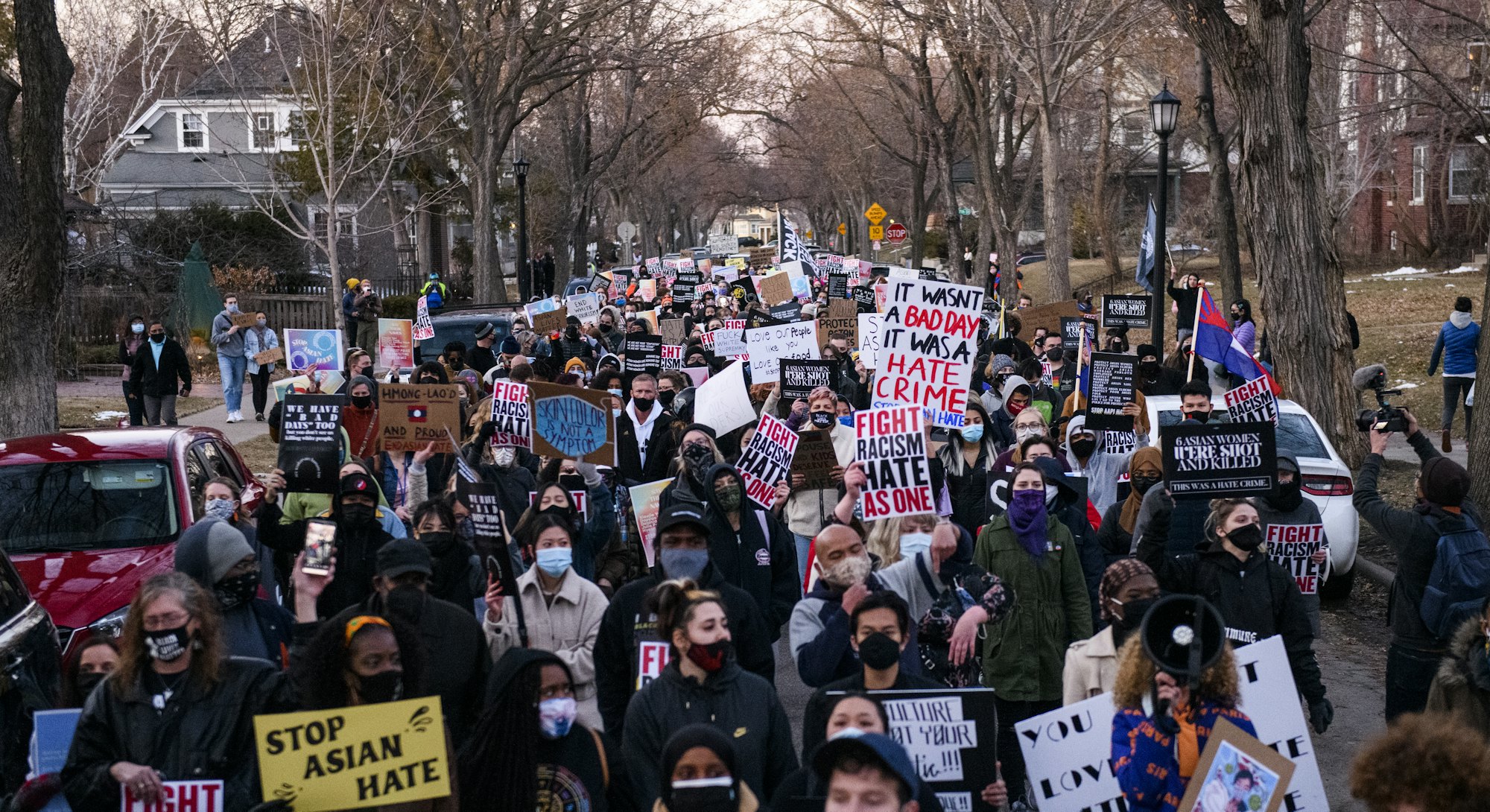 MINNEAPOLIS, MN - MARCH 18: People march through a neighborhood to protest against anti-Asian violen...