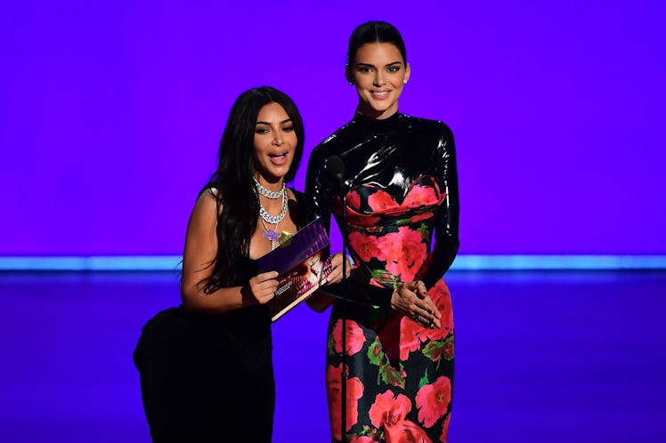 US television personalities Kim Kardashian (L) and Kendall Jenner present the award for Outstanding ...