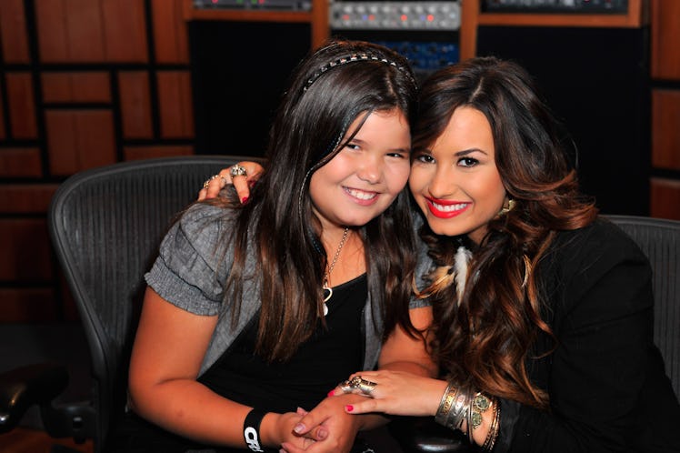 HOLLYWOOD, CA - JULY 21:  Actress/singer Demi Lovato (R) and sister actress Madison De La Garza atte...