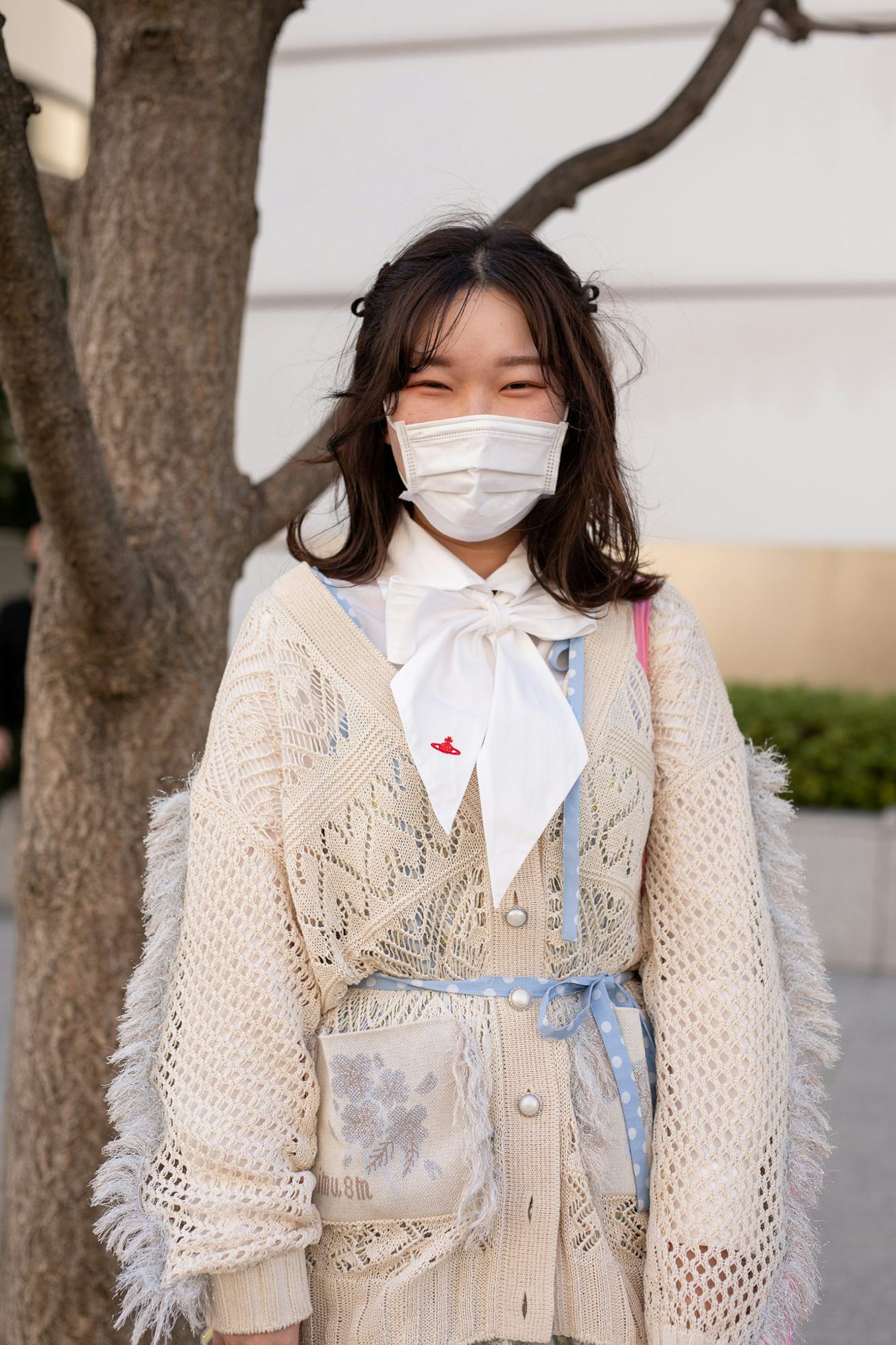 TOKYO, JAPAN - MARCH 15: A guest is seen on the street wearing Mikio Sakabe beige outfit with white ...