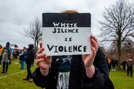 AMSTERDAM, NETHERLANDS - 2021/03/21: A protester holds an anti racist placard during the demonstrati...