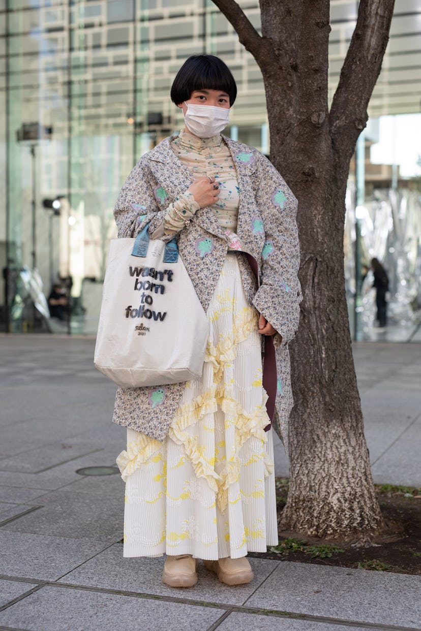 TOKYO, JAPAN - MARCH 15: A guest is seen on the street wearing Mikio Sakabe outfit, 'wasn't born to ...