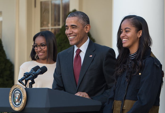 US President Barack Obama speaks next to daughters Malia (R) and Sasha before "pardoning" the Nation...