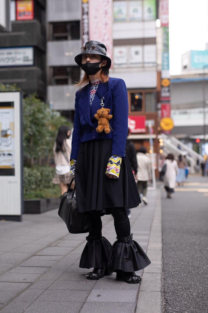 TOKYO, JAPAN - MARCH 20: A guest is seen on the street wearing a Charles Jeffery Loverboy outfit wit...