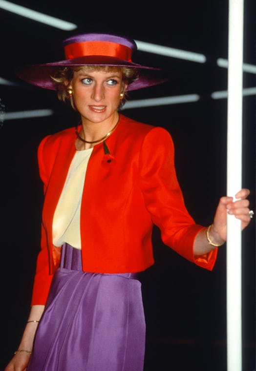 HONG KONG, CHINA - NOVEMBER 07: Diana, Princess of Wales, wearing a red and purple suit designed by ...