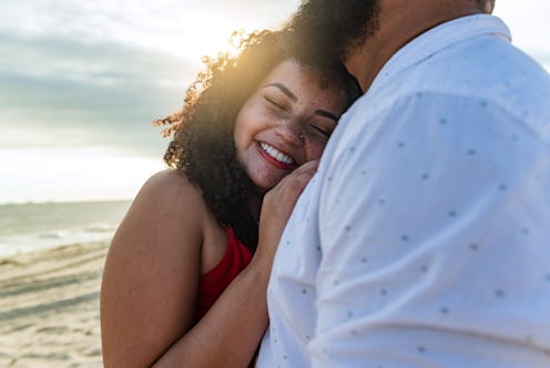 Happy couple enjoys romantic moments by the sea