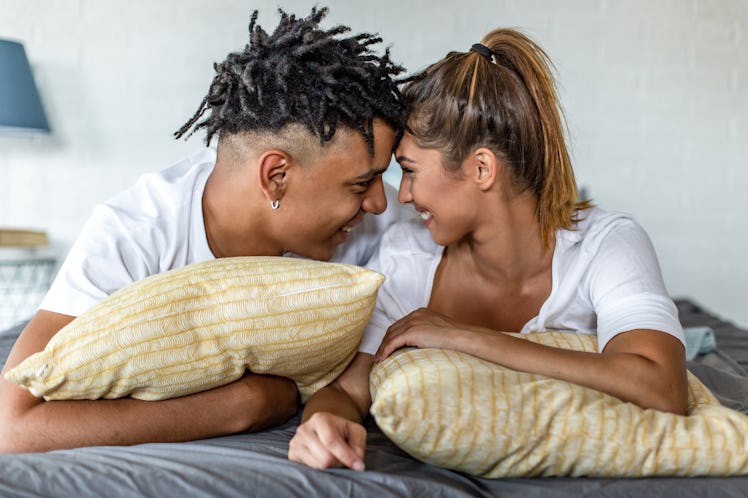 African American couple in love, laying in bed