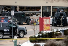BOULDER, CO - MARCH 22: Smashed windows are left at the scene after a gunman opened fire at a King S...