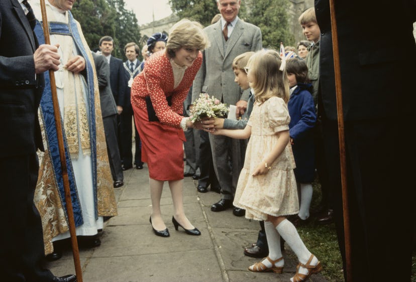 Newly engaged Diana Spencer chats with a young fan.