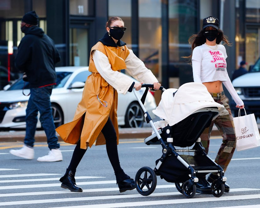 Gigi Hadid takes her daughter Khai shopping in a stroller in Soho on March 22, 2021 in New York City...
