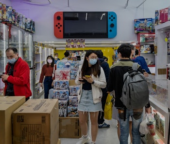HONG KONG, CHINA - 2021/02/24: People are seen at a store selling Japanese multinational video gamin...