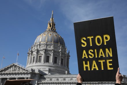 SAN FRANCISCO, CA - MARCH 22: A demonstrator holds a sign saying Stop Asian Hate as they march towar...