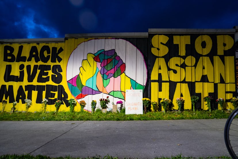 ATLANTA, GA - MARCH 21: Members of the Bad Asian and Civic Walls groups paint a mural near Krog Stre...