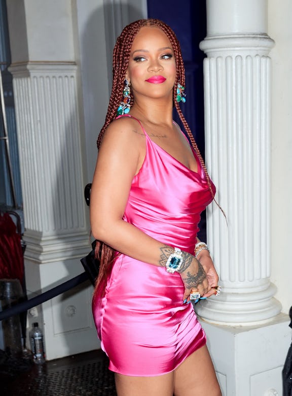 NEW YORK, NY - JUNE 18:  Rihanna wears a hot pink dress when arriving at a Fenty event on June 18, 2...