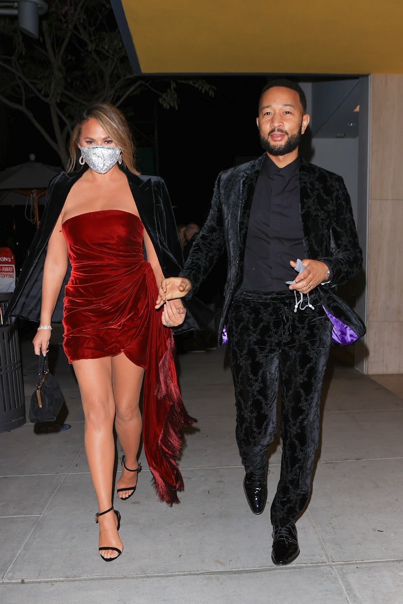 LOS ANGELES, CA - MARCH 14: Chrissy Teigen and John Legend are seen on March 14, 2021 in Los Angeles...