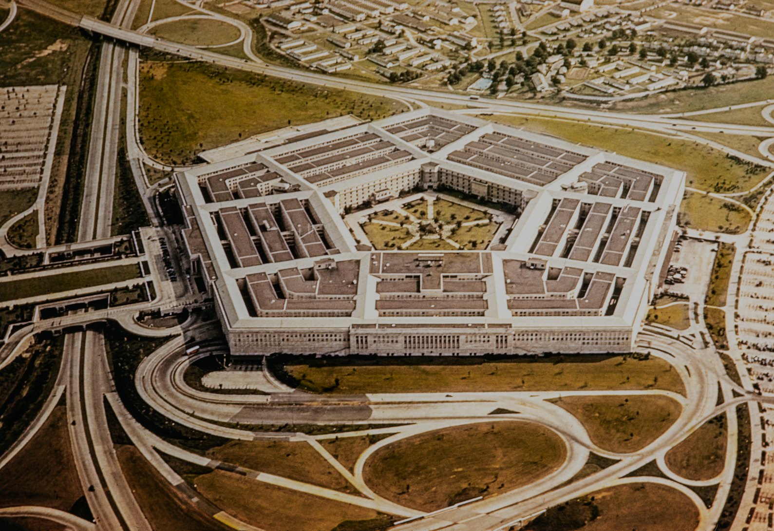 Washington during the 1950's. The United States Department of Defense is an executive branch department of the federal government charged with coordinating and supervising all agencies and functions of the government directly related to national security and the United States Armed Forces. Aerial of the Pentagon, the Department of Defense headquarters in Arlington, Virginia, near Washington DC, with I-395 freeway on the left, and the Air Force Memorial up middle.
