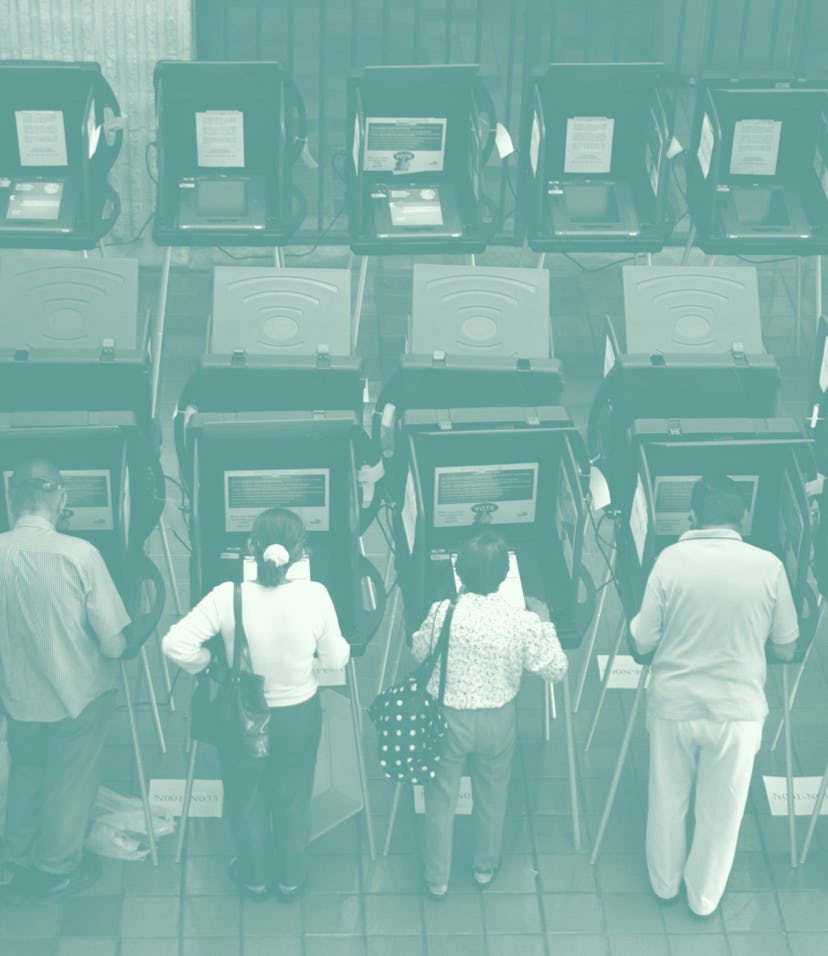 Voters using touch screen voting machines for the presidential election at the Stephen P. Clark Gove...