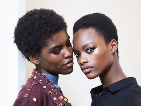 Models Amilna Estevão (L) and Mayowa Nicholas (R) poses prior the Balmain show as part of the Paris ...