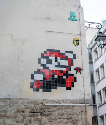 PARIS, FRANCE - APRIL 07: Street art by artist Invader, showing the video game Mario charatcter fro...