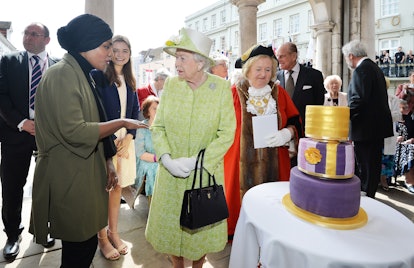 WINDSOR, ENGLAND - APRIL 21:  Queen Elizabeth II receives a birthday cake from Nadiya Hussain, winne...