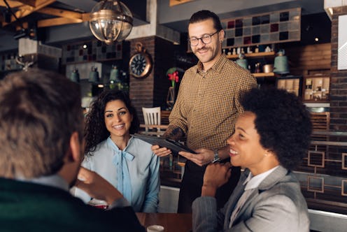 Group of business people meeting at the restaurant.
