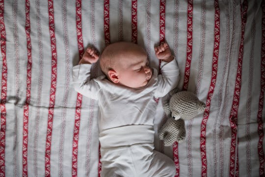 Baby Extends Arms Backwards When Picked Up: What Does It Mean?