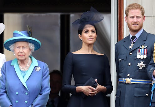 Queen Elizabeth, Meghan Markle, and Prince Harry in March 2020. Photo via Getty