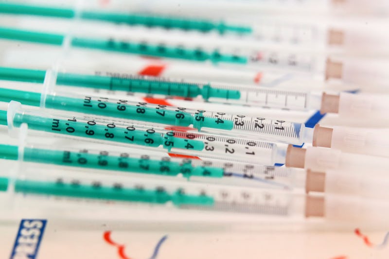 Covid-19 vaccines on a tray. Women describe what it's like to be eligible for the covid vaccine base...