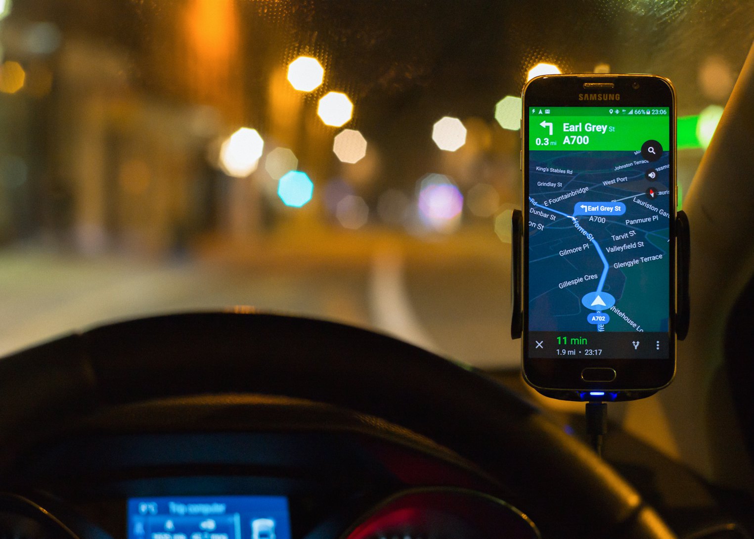 Edinburgh, UK - April 19, 2016:  Google Maps Navigation software running as an app on a Samsung S6 smartphone, mounted above a car dashboard to provide driving directions.