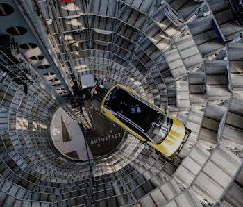 26 March 2021, Lower Saxony, Wolfsburg: A Volkswagen ID.4 stands in a car tower at Autostadt. Volksw...