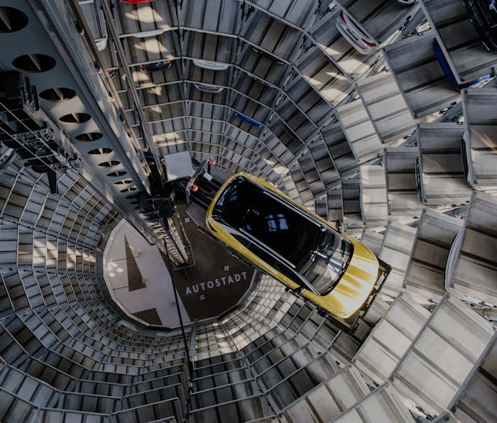 26 March 2021, Lower Saxony, Wolfsburg: A Volkswagen ID.4 stands in a car tower at Autostadt. Volksw...