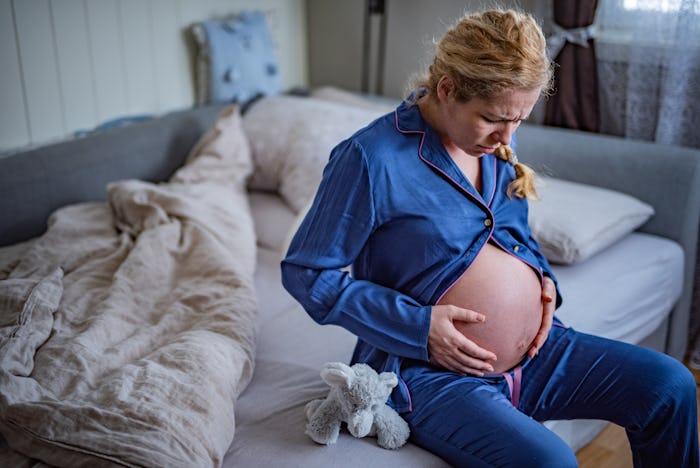 uncomfortable pregnant woman