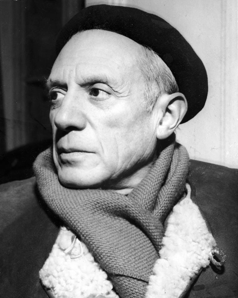 Portrait of Spanish-born artist Pablo Picasso (1881 - 1973) in a winter coat, scarf, and beret, 1950...