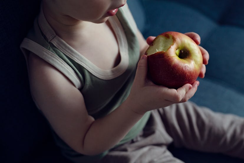 toddler with apple