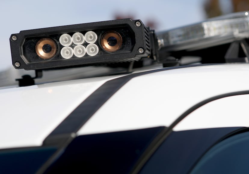 One of three license plate reader cameras mounted to the roof of a patrol vehicle is photographed at...