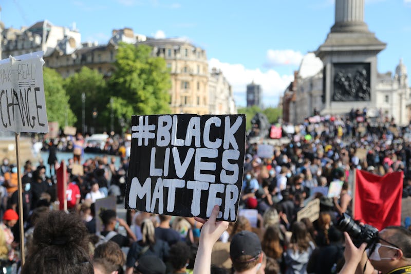 LONDON, ENGLAND - JUNE 20: People, holding banners, take part in a march from Hyde Park towards Trafalgar Square to protest against racism and inequality, on June 20, 2020 in London, United Kingdom. (Photo by Tayfun Salci/Anadolu Agency via Getty Images)