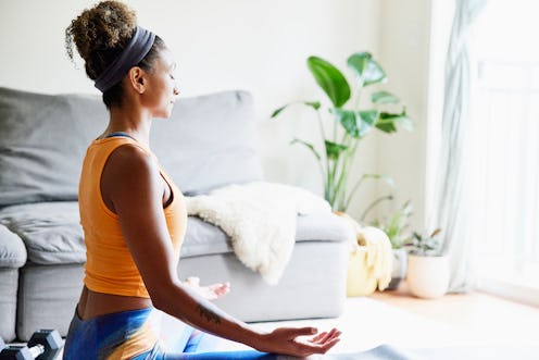 woman meditating indoors