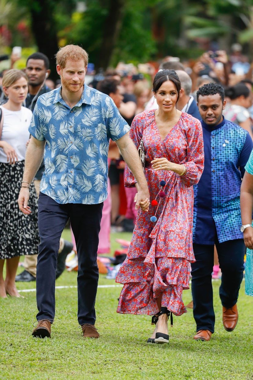 Prince Harry and Meghan Markle holding hands in Fiji, 2018.