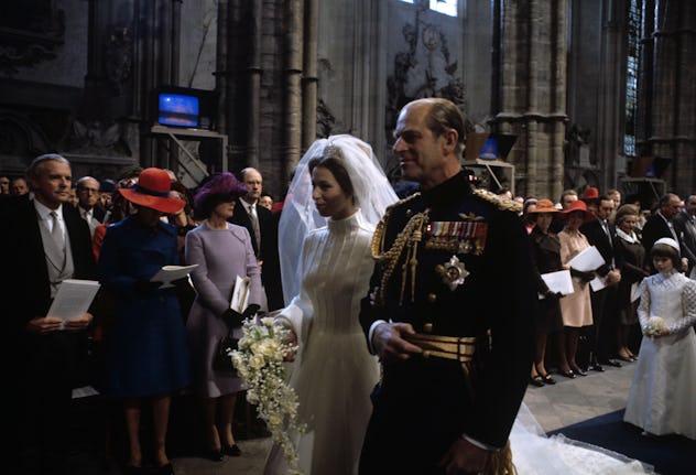 Prince Philip walks Princess Anne down the aisle in 1973.
