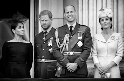 Meghan Markle standing next to prince harry, prince william and kate middleton 