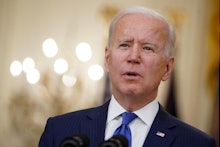 US President Joe Biden speaks during International Women's Day in the East Room of the White House i...